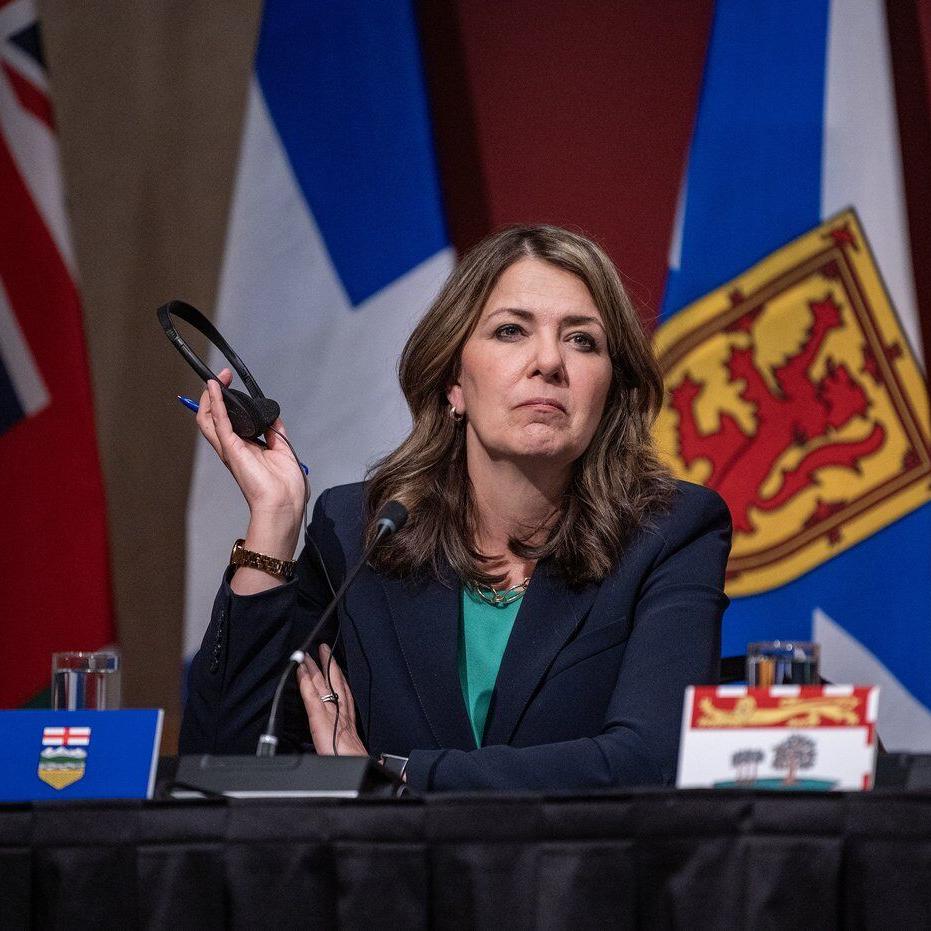 Alberta premier defends charging most Albertans for COVID-19 vaccines